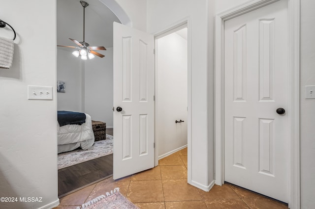 corridor with light tile patterned flooring