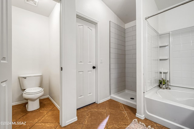 bathroom featuring tile patterned flooring, toilet, and independent shower and bath