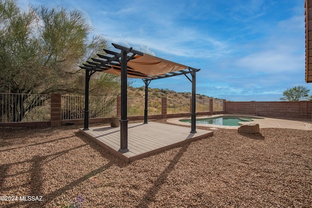 exterior space with a pergola and a fenced in pool