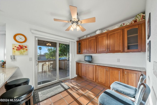 kitchen with ceiling fan and light tile patterned flooring