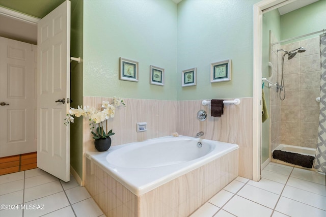 bathroom featuring tile patterned flooring and shower with separate bathtub