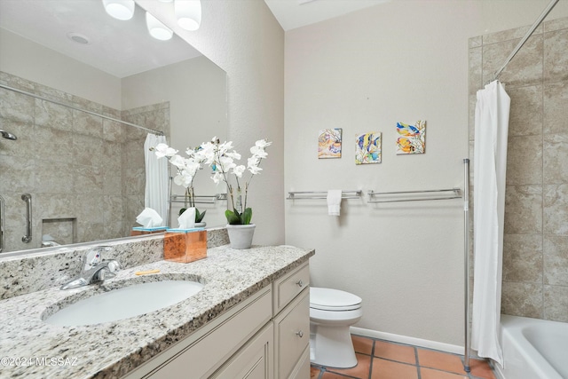 full bathroom featuring tile patterned flooring, vanity, toilet, and shower / bath combo with shower curtain