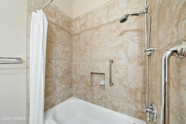 bathroom with shower / bathtub combination with curtain