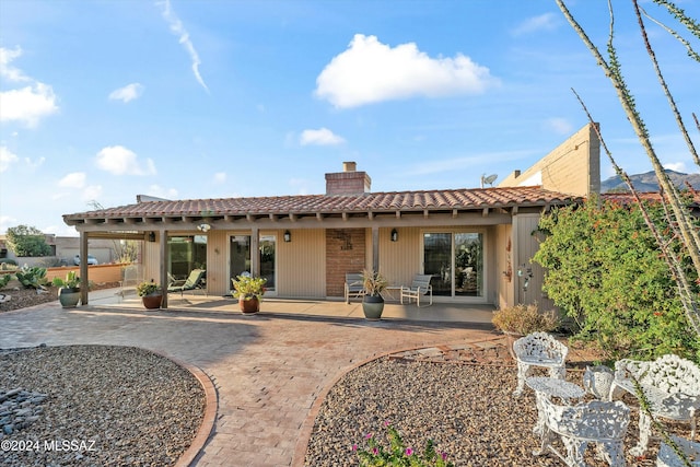 rear view of house featuring a patio area