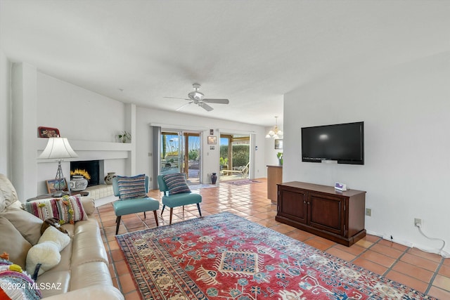 living room with ceiling fan and light tile patterned flooring