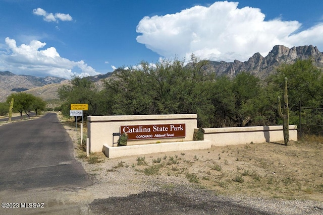 community sign featuring a mountain view