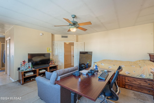 carpeted living room with ceiling fan