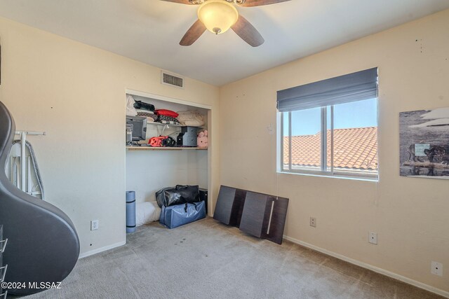 carpeted bedroom featuring ceiling fan