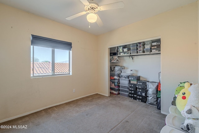 interior space with ceiling fan