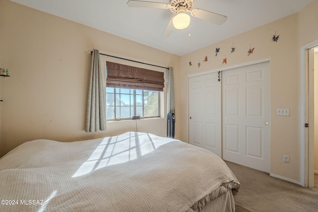 bedroom with carpet floors, a closet, and ceiling fan