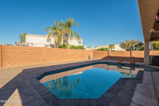 view of swimming pool featuring a patio