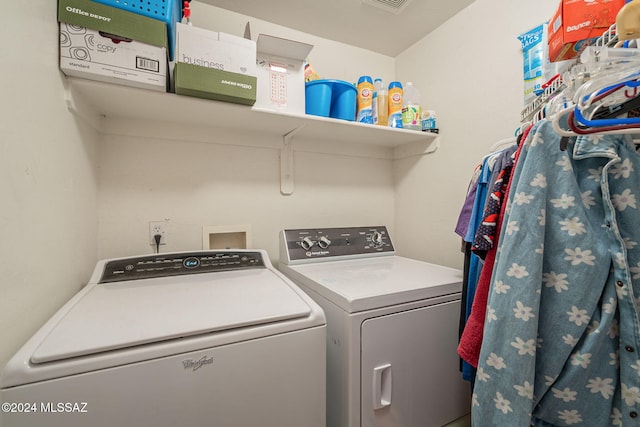 laundry room with separate washer and dryer