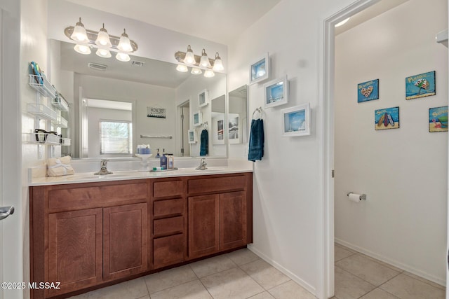 bathroom with tile patterned floors and vanity