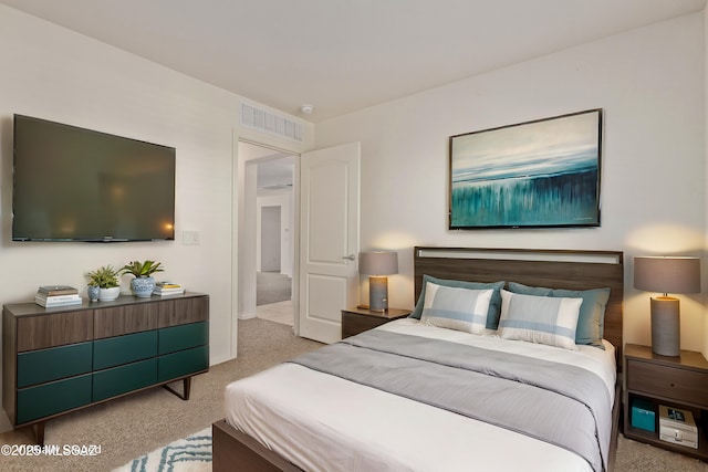 bedroom featuring light colored carpet