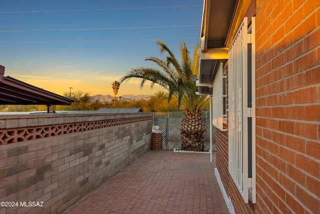 view of patio terrace at dusk