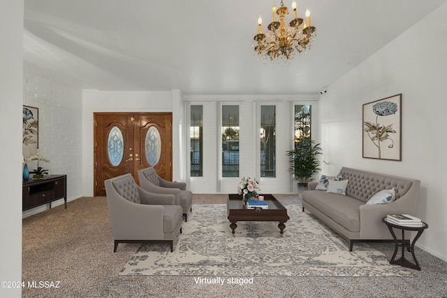 carpeted living room with a chandelier