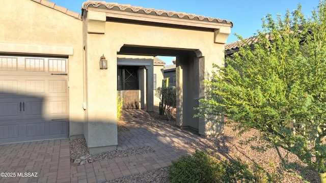 entrance to property featuring a garage