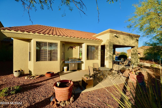 back of house featuring a patio area