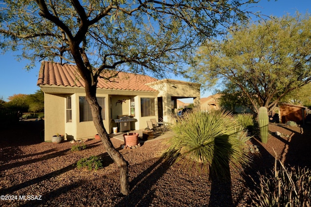 rear view of house featuring a patio area