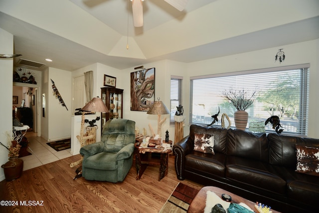 living room with ceiling fan and light hardwood / wood-style floors