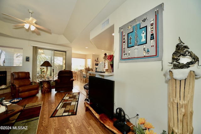 living room with ceiling fan and wood-type flooring