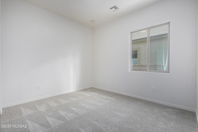 empty room with light colored carpet