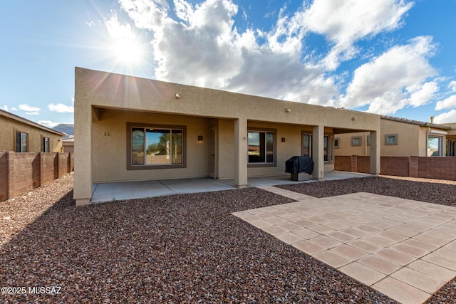 back of house featuring a patio