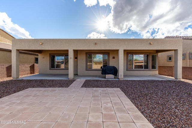 rear view of house featuring a patio