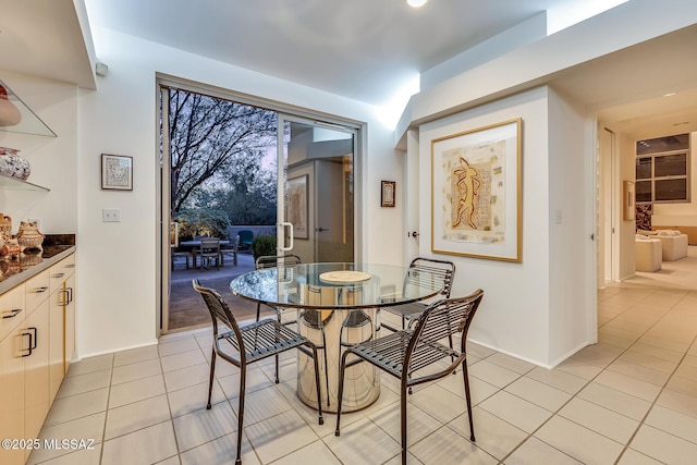 dining area featuring light tile patterned floors