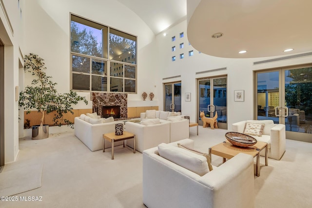 living room with lofted ceiling and carpet flooring