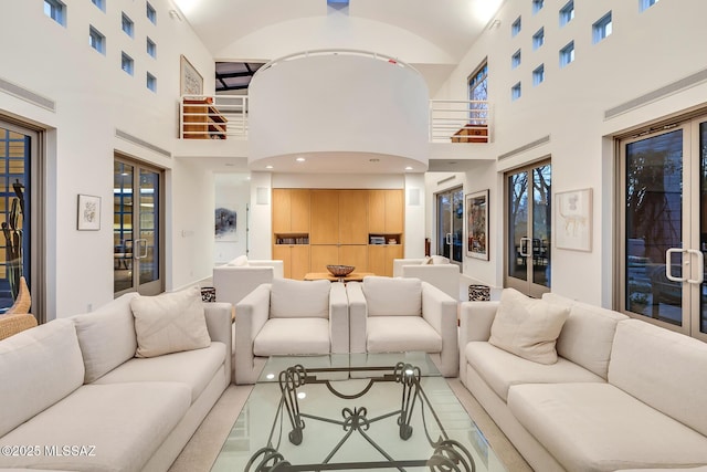 living room with a high ceiling