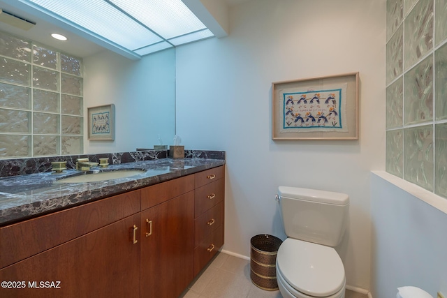 bathroom with toilet and vanity