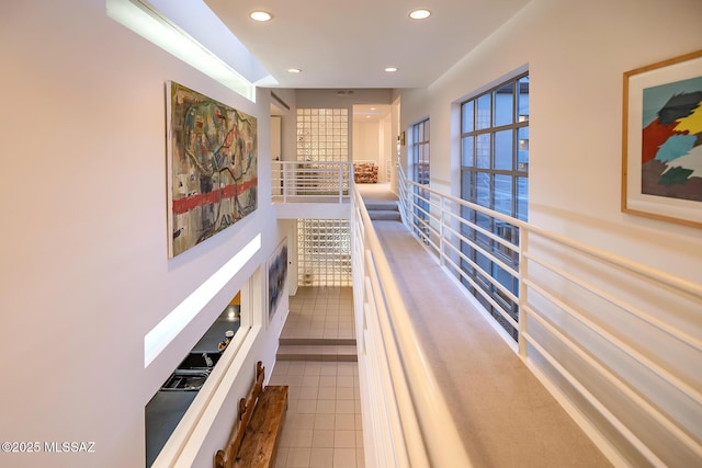 hall featuring tile patterned flooring