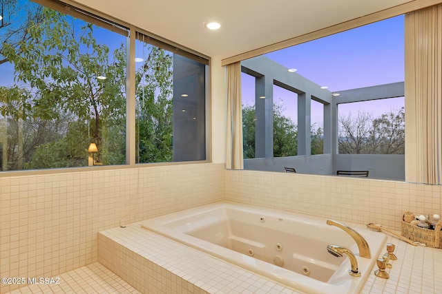 bathroom with tiled bath