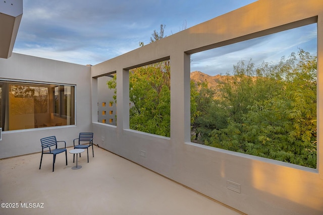 sunroom / solarium with a mountain view