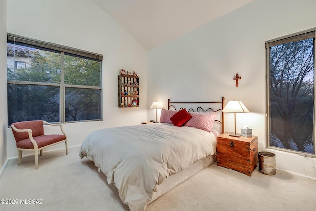 carpeted bedroom featuring vaulted ceiling