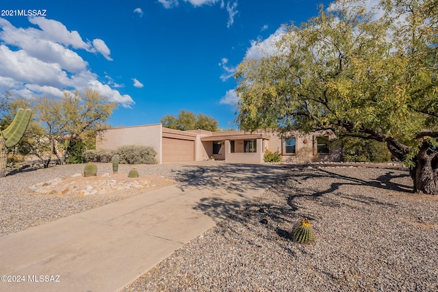 view of front of property with a garage