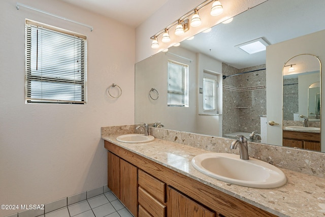 bathroom with tile patterned flooring and vanity