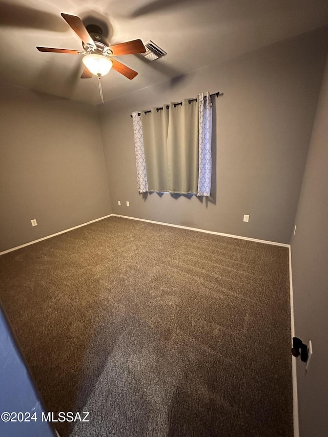 carpeted empty room with ceiling fan