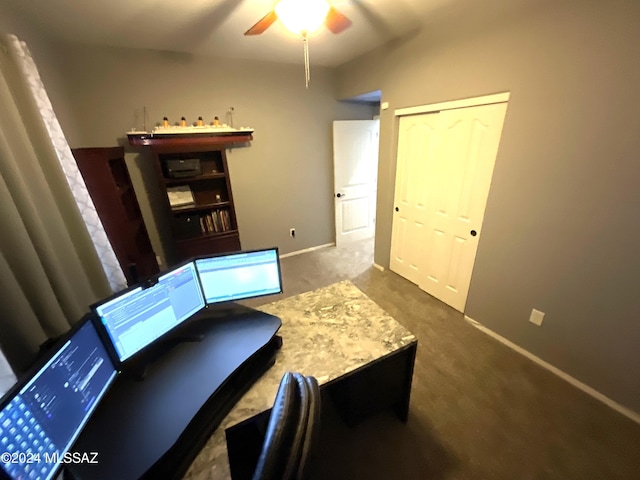 carpeted office featuring ceiling fan