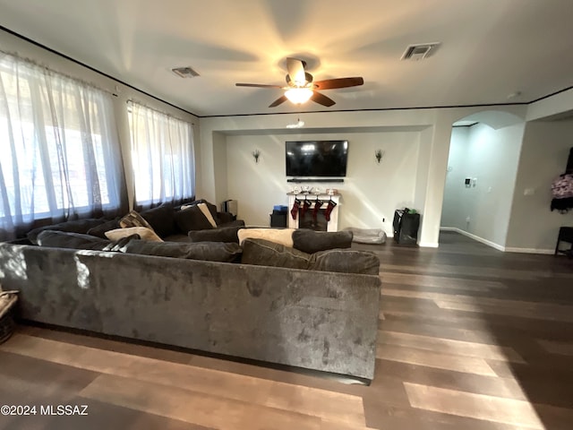 living room with hardwood / wood-style floors and ceiling fan