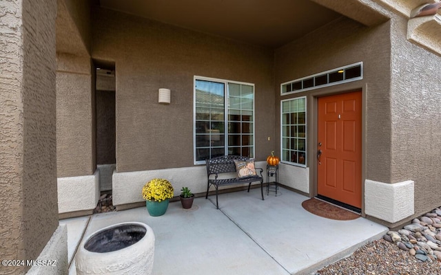 property entrance featuring a patio