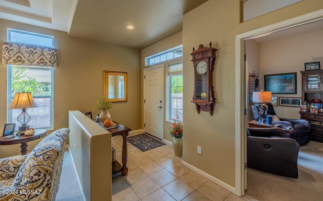 entryway featuring light tile patterned floors and a wealth of natural light