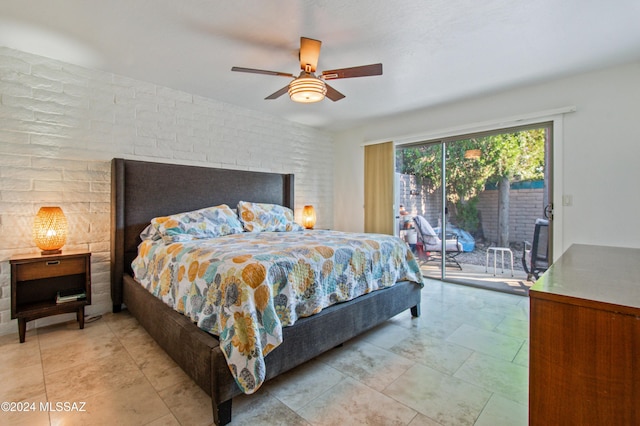 bedroom featuring ceiling fan and access to exterior