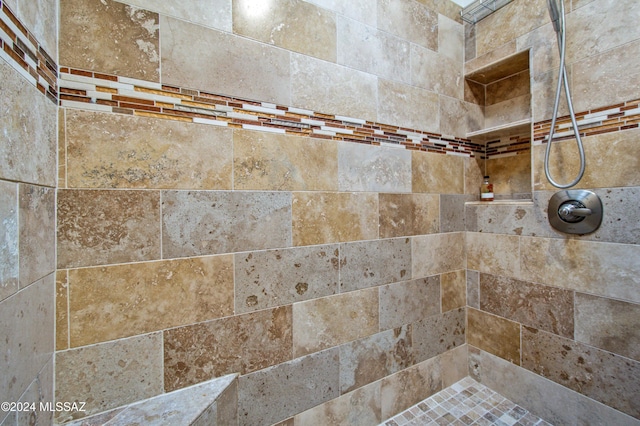 room details featuring tiled shower