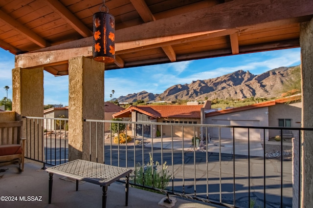 view of patio / terrace with a balcony and a mountain view