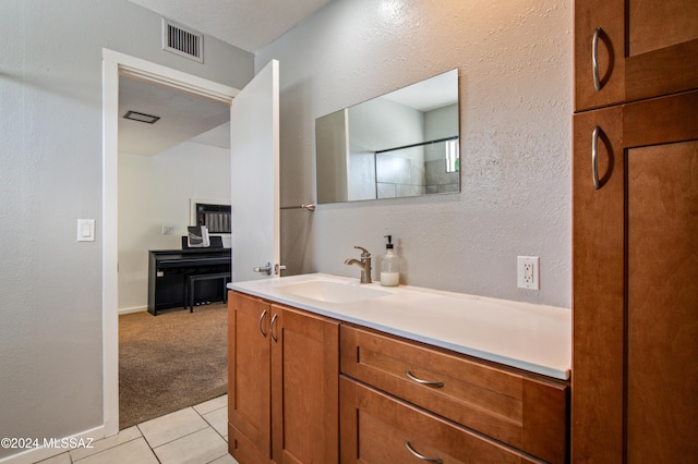 bathroom featuring tile patterned floors and vanity