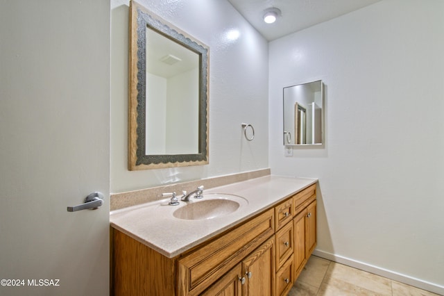 bathroom featuring tile patterned floors and vanity