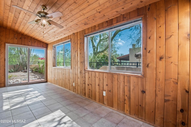 unfurnished sunroom with lofted ceiling, ceiling fan, and wood ceiling