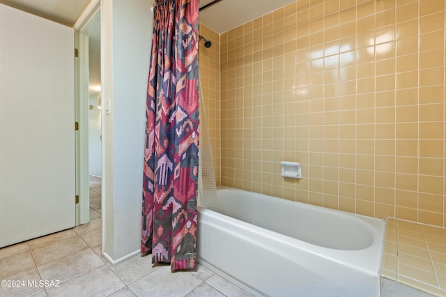 bathroom with tile patterned flooring and shower / tub combo